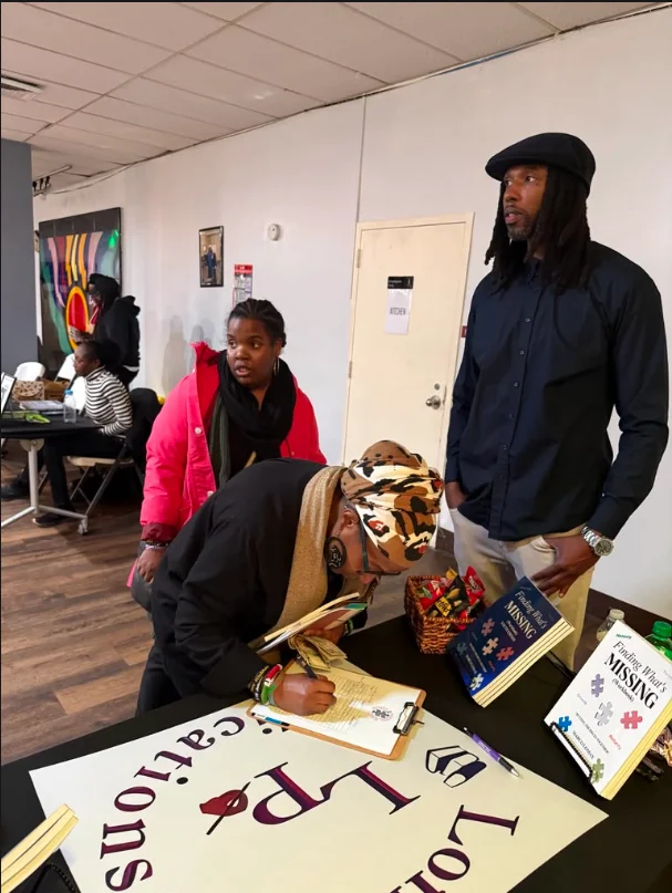 Marco Lomax signing books at a Lomax Publications event