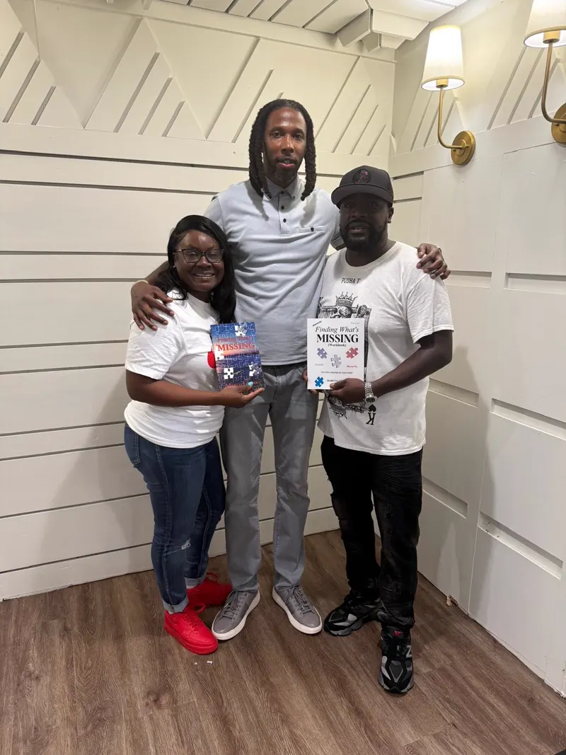 Readers holding their copies of Finding What's Missing